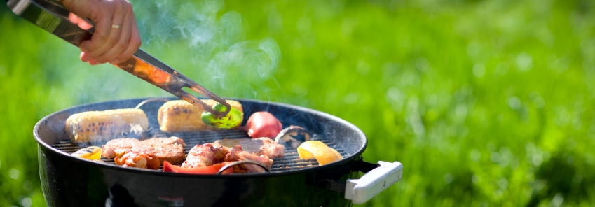 Grilling at summer weekend. Fresh meat and vegetables preparing on grill.